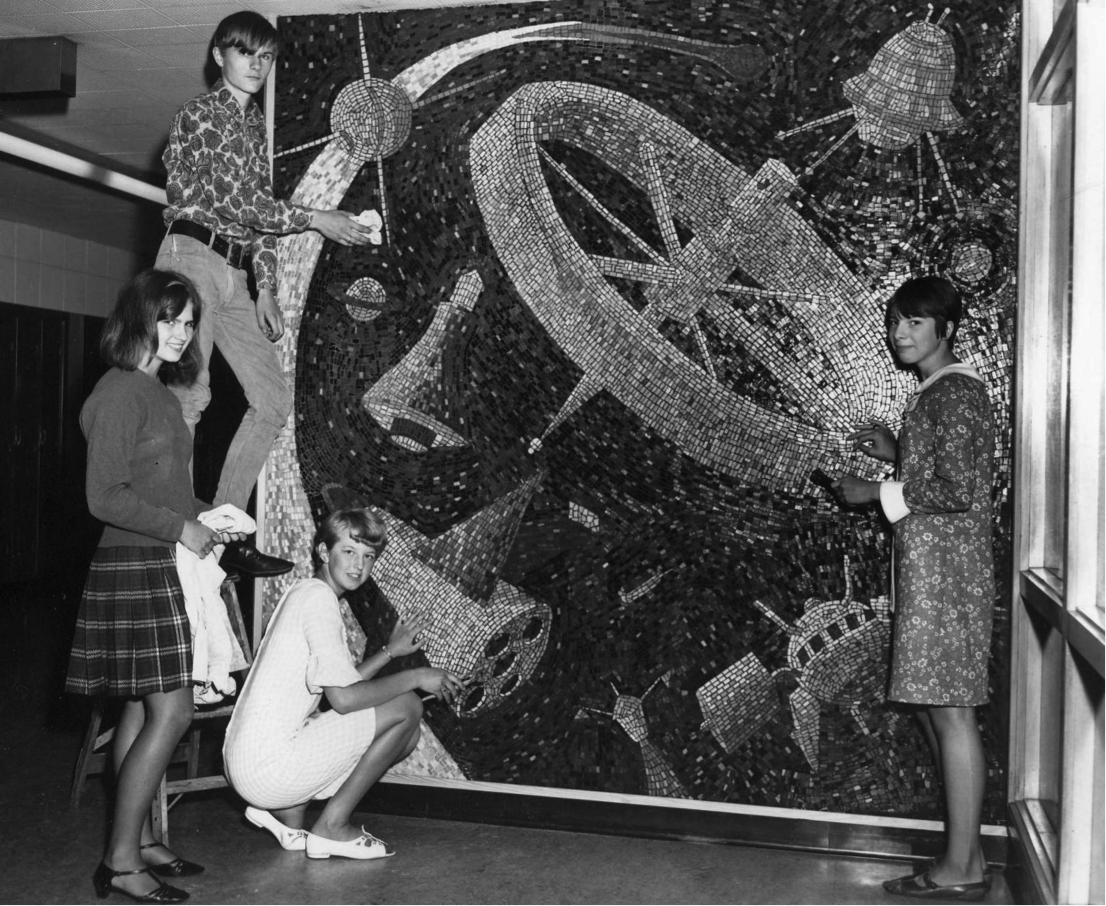 Four students posed in front of the ‘Space Mural’ (1967.)