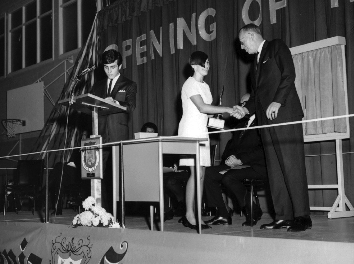Opening of the New Wing (1967.) Mr. J. R. Swanson, Principal, presents athletic trophy (with Joe Ferrera, Student Council President)