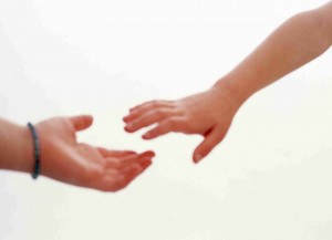 wpid-hands_reaching_together1